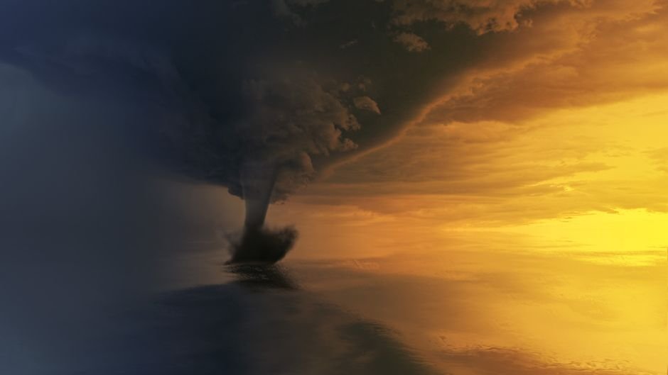 Cyclone Storm Threatens Andhra Pradesh and Odisha Coasts A powerful tornado over the ocean during a dramatic sunset, capturing the storm's intensity and beauty.