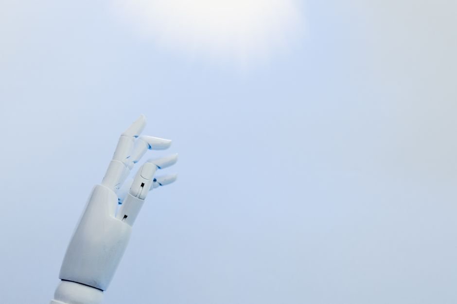 Amazon Bedrock AgentCore Enables Self-Improving Document Processing A robotic hand reaching towards a bright light on a white background symbolizing innovation.