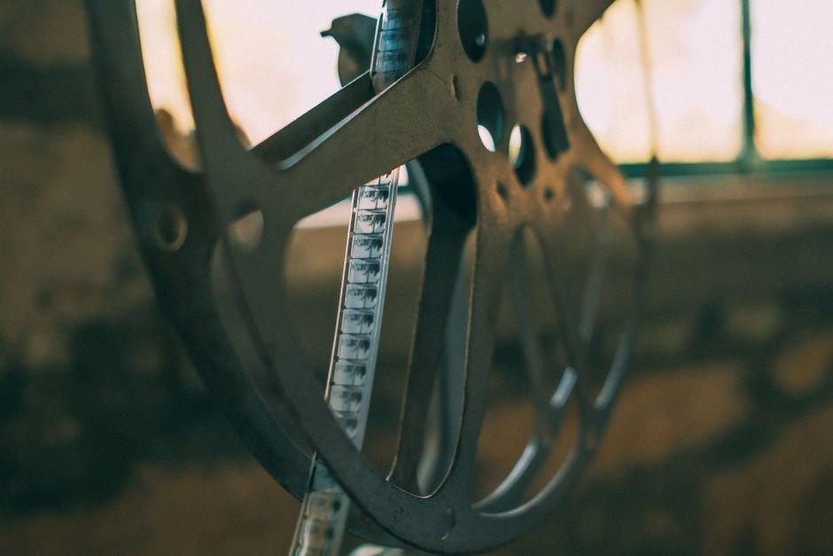 Yeon Sang-ho’s Thriller ‘Paradise Lost’ Secures Global Distribution Ahead of U.S. Premiere at Hawaii Film Festival Artistic shot of a vintage film reel with soft light creating a nostalgic atmosphere.
