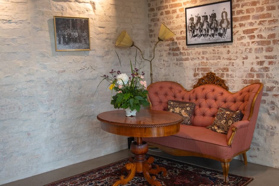 AI Firm Galleri5 Expands into Indonesian Mythology with Cross-Border IP Pact Charming vintage cafe interior in Jönköping, Sweden featuring a red sofa and classic decor.