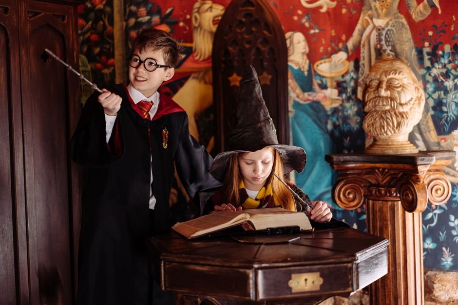 Harry Potter Magic to Illuminate London’s Oxford Street This Christmas Children dressed as wizards engaged in magic-themed play, exploring spells in a fantasy setting.