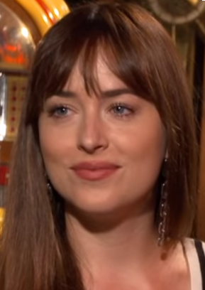 Taylor Swift Makes Surprise Cameo During Dakota Johnson’s “SNL” Monologue Dakota Johnson, in 2018.