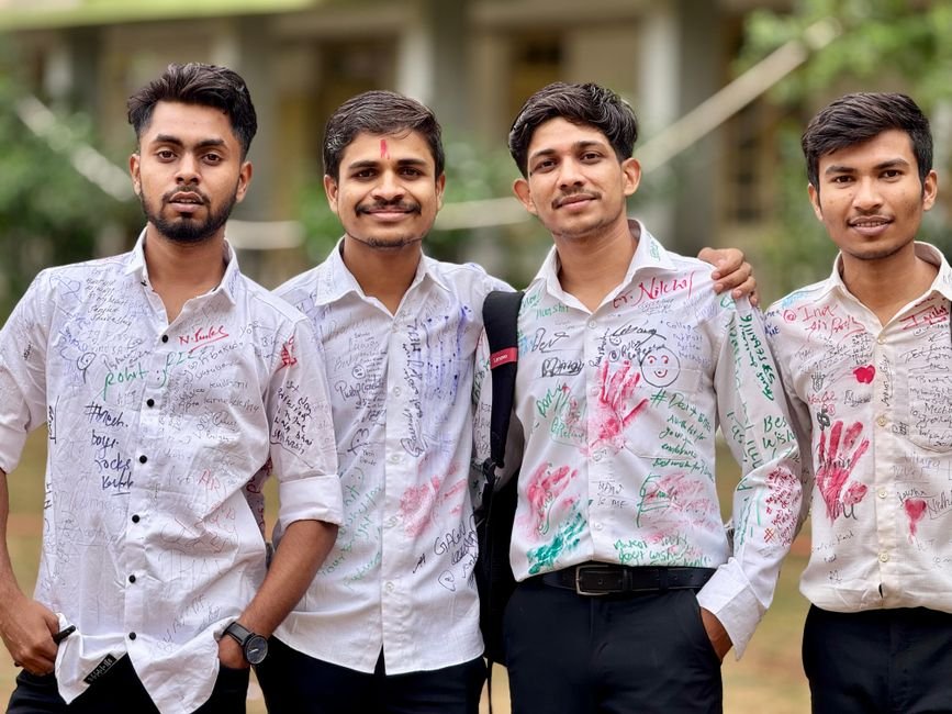 Hamirpur Government College Tops Himachal Pradesh Rankings Group of young men with autographed shirts celebrating together outdoors.