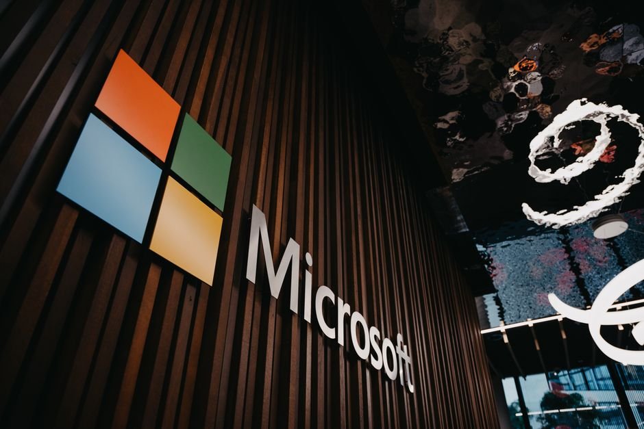 Microsoft and Hugging Face Release ThinkingBox: A New Benchmark for Evaluating AI Agents Interior view of Microsoft office with logo on wooden wall in Brussels, Belgium.