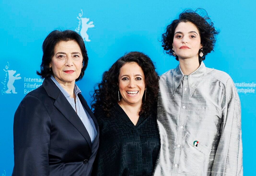 Hiam Abbass to Be Honored with European Film Academy’s Lifetime Achievement Award (L-R) Hiam Abbass, Director Leyla Bouzid and Eya Bouteraa pose at the "À Voix Basse" (In A Whisper) photocall at Berlinale 2026 in Berlin, Germany