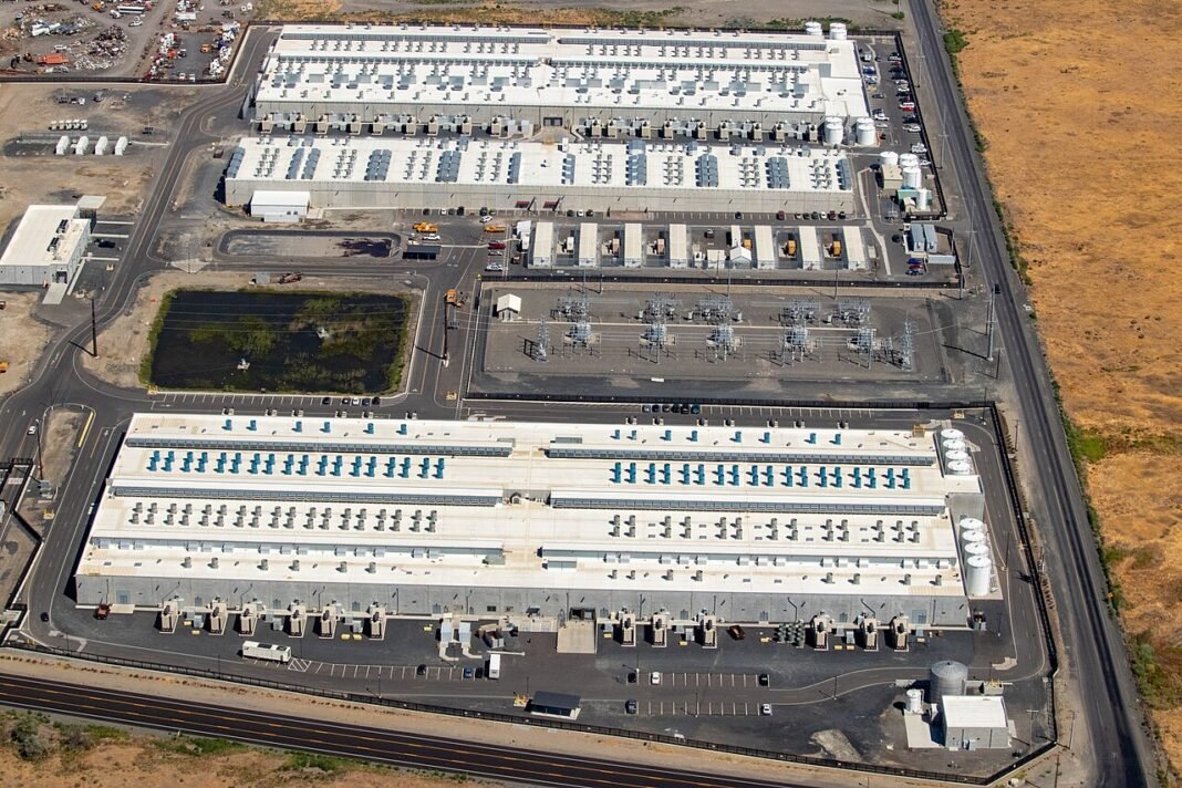 AWS Enhances Amazon Bedrock and AgentCore with Expanded Model Choices and Agent Capabilities Part of AWS's us-west-2 availability zone, showing three datacenters