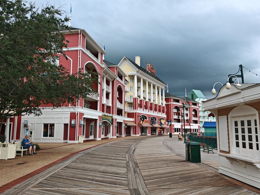 Disney Executive Highlights Substance in K-Drama ‘The Remarried Empress’ Amid Streaming Boom Picturesque view of Disney's Boardwalk Resort, Lake Buena Vista under stormy skies.