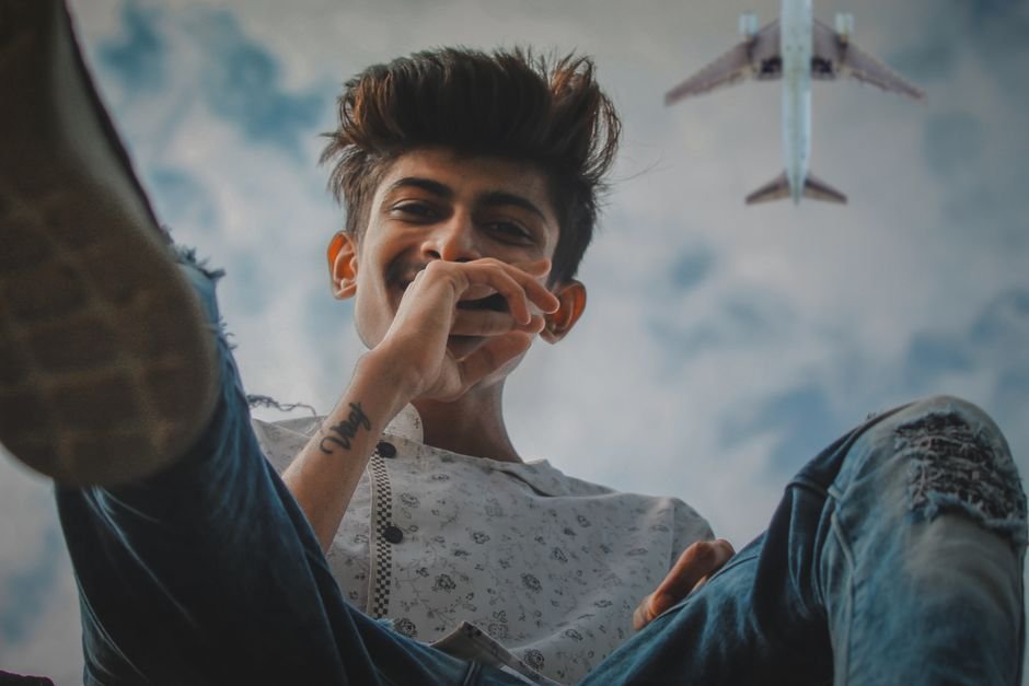 Jammu and Kashmir: Two Srinagar Boys Rescued After Going Missing During Trek in Kangan Forest Teenager enjoying leisure time outdoors with airplane flying overhead, captured in a lively moment.