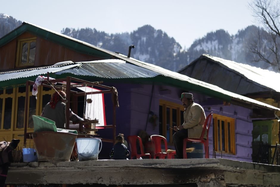Himachal Pradesh: Karsog Nagar Panchayat Prioritizes Seriously Ill for BPL List Traditional rural life captured against a picturesque mountain background, reflecting cultural simplicity.