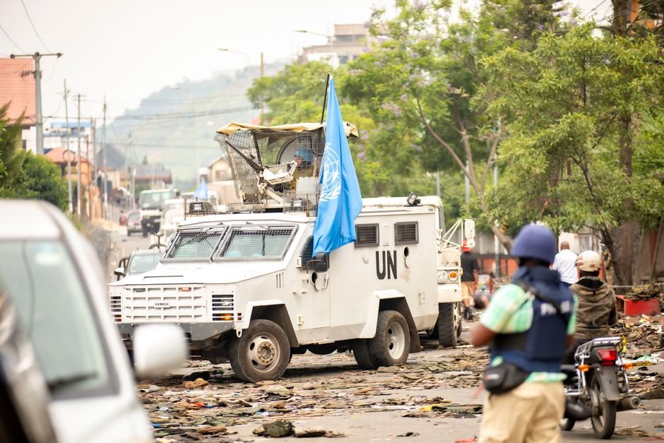 UNDRR Champions Climate Resilience and Early Warning Systems at Cairo Water Week United Nations armored vehicle navigating street amid conflict. Peacekeeping and security presence.