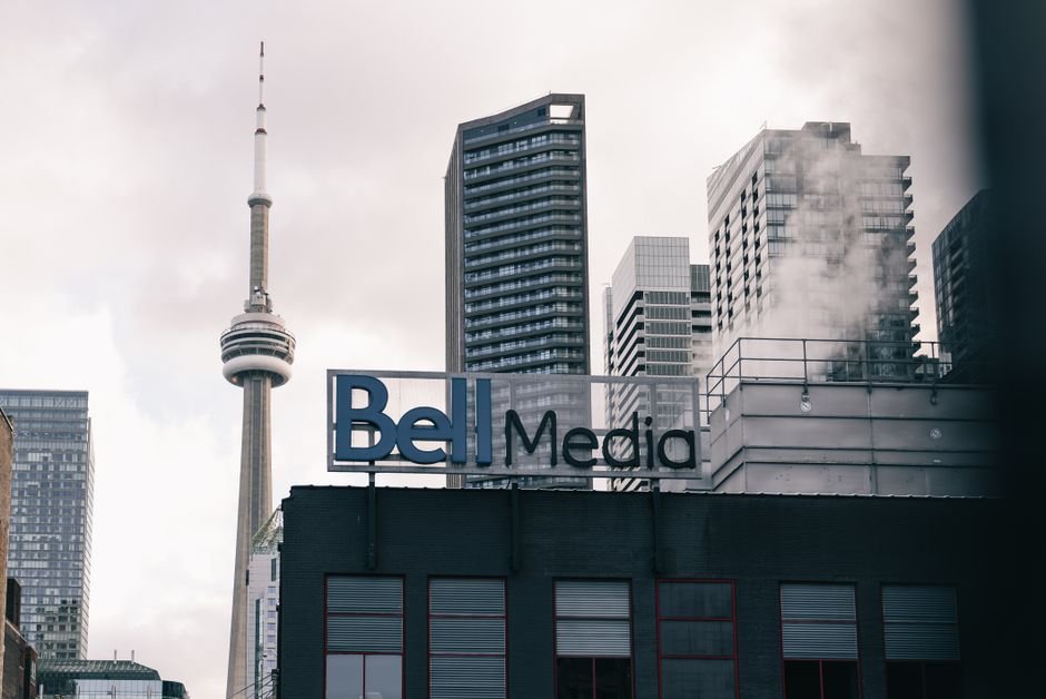 Canadian TV’s ‘Heated Rivalry’ Ignites International Demand for Local Content View of Toronto skyline featuring the CN Tower and Bell Media sign.