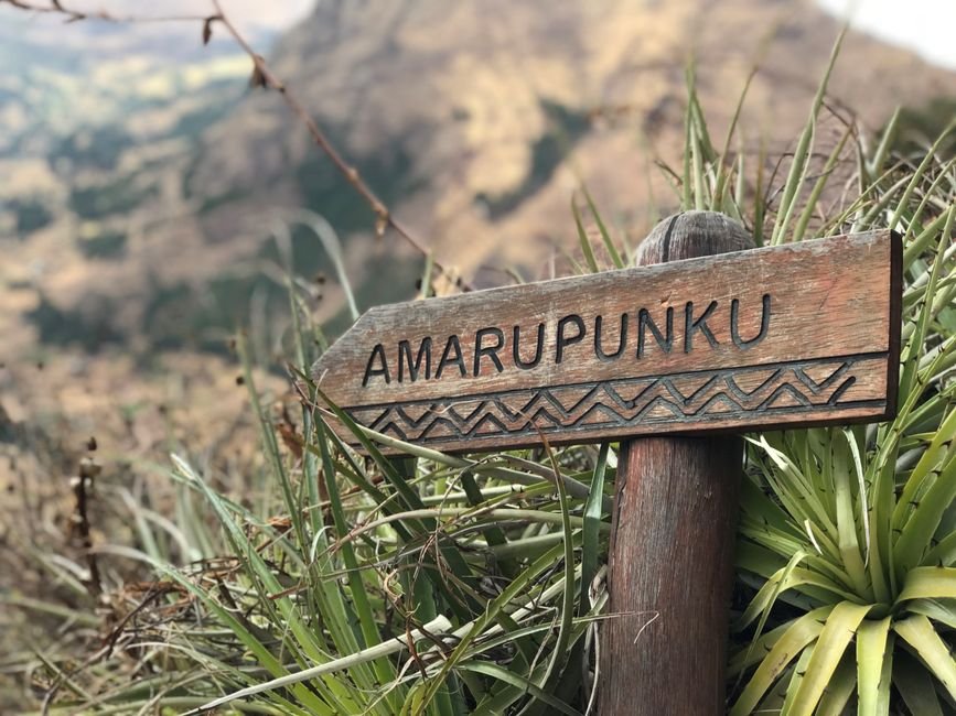 Women Leaders in Samoa and Philippines Honored for Advancing Inclusive Disaster Resilience Wooden sign reading 'Amarupunku' in natural landscape near Cusco, Peru.